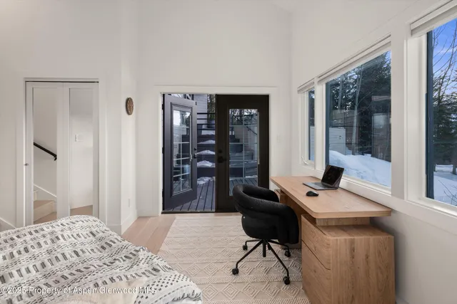 a bedroom with a bed and a cabinets