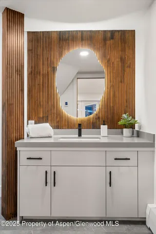 an aerial view of a house with a yard and mountain view in back
