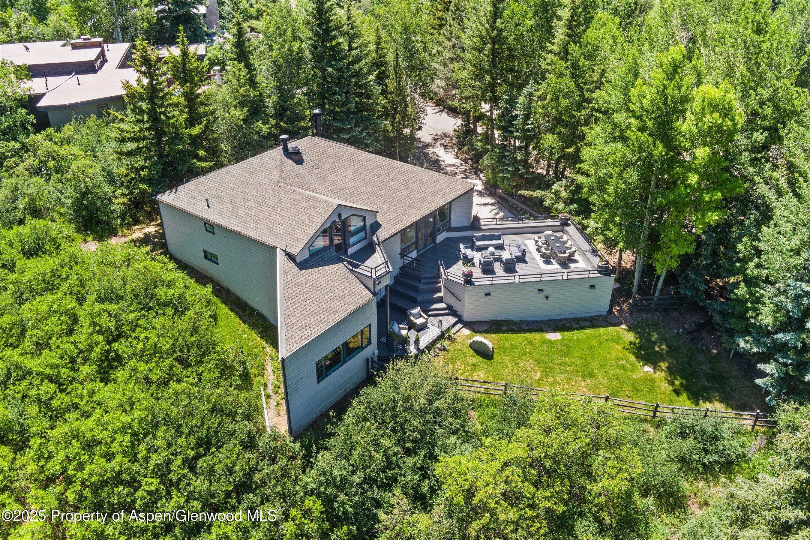 75 Bennett Court Aspen, CO 81611 - Photo 58 of 65 an aerial view of a house with yard swimming pool and outdoor seating