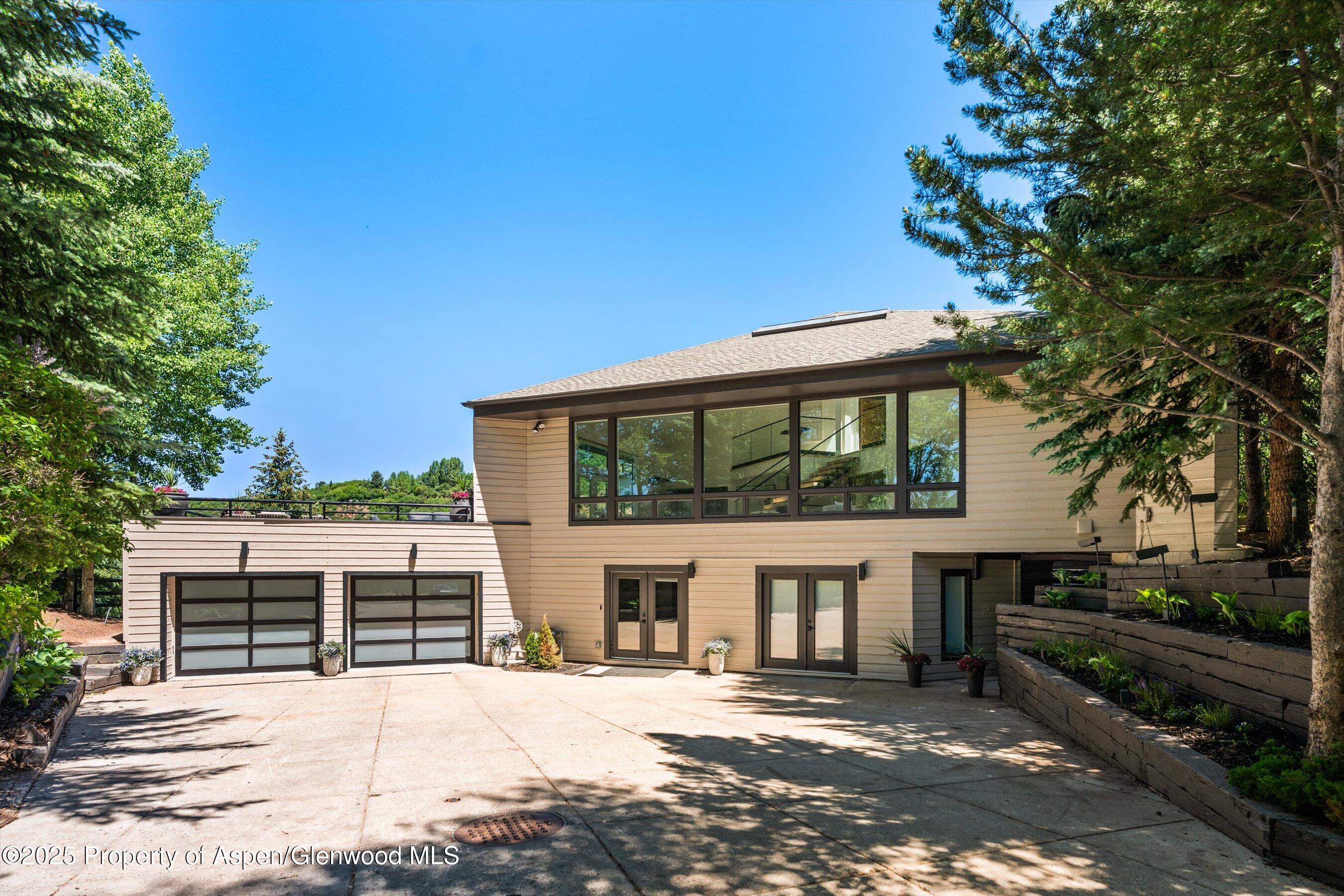 75 Bennett Court Aspen, CO 81611 - Photo 62 of 65 a front view of a house with a yard