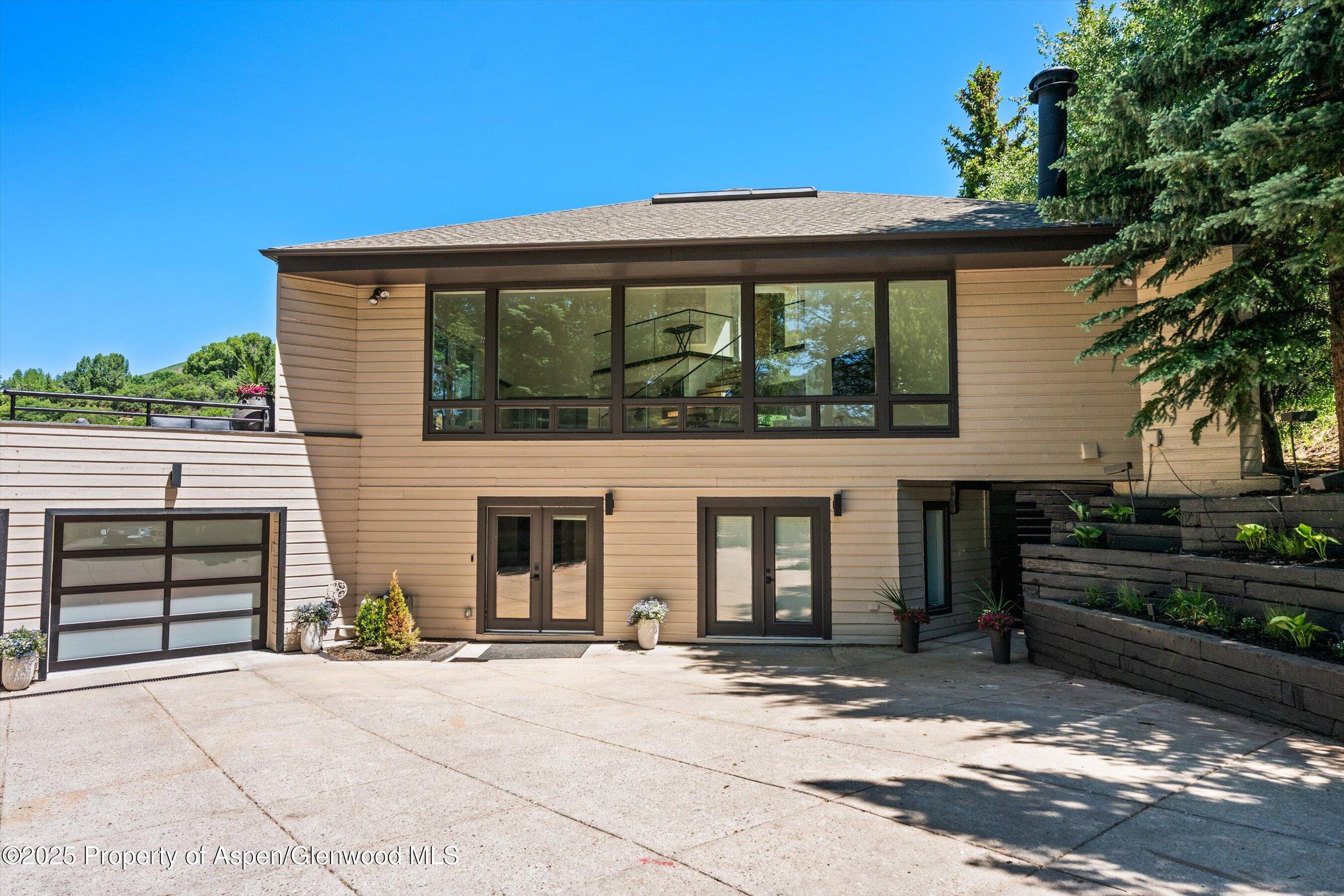 75 Bennett Court Aspen, CO 81611 - Photo 63 of 65 a front view of a house with a yard