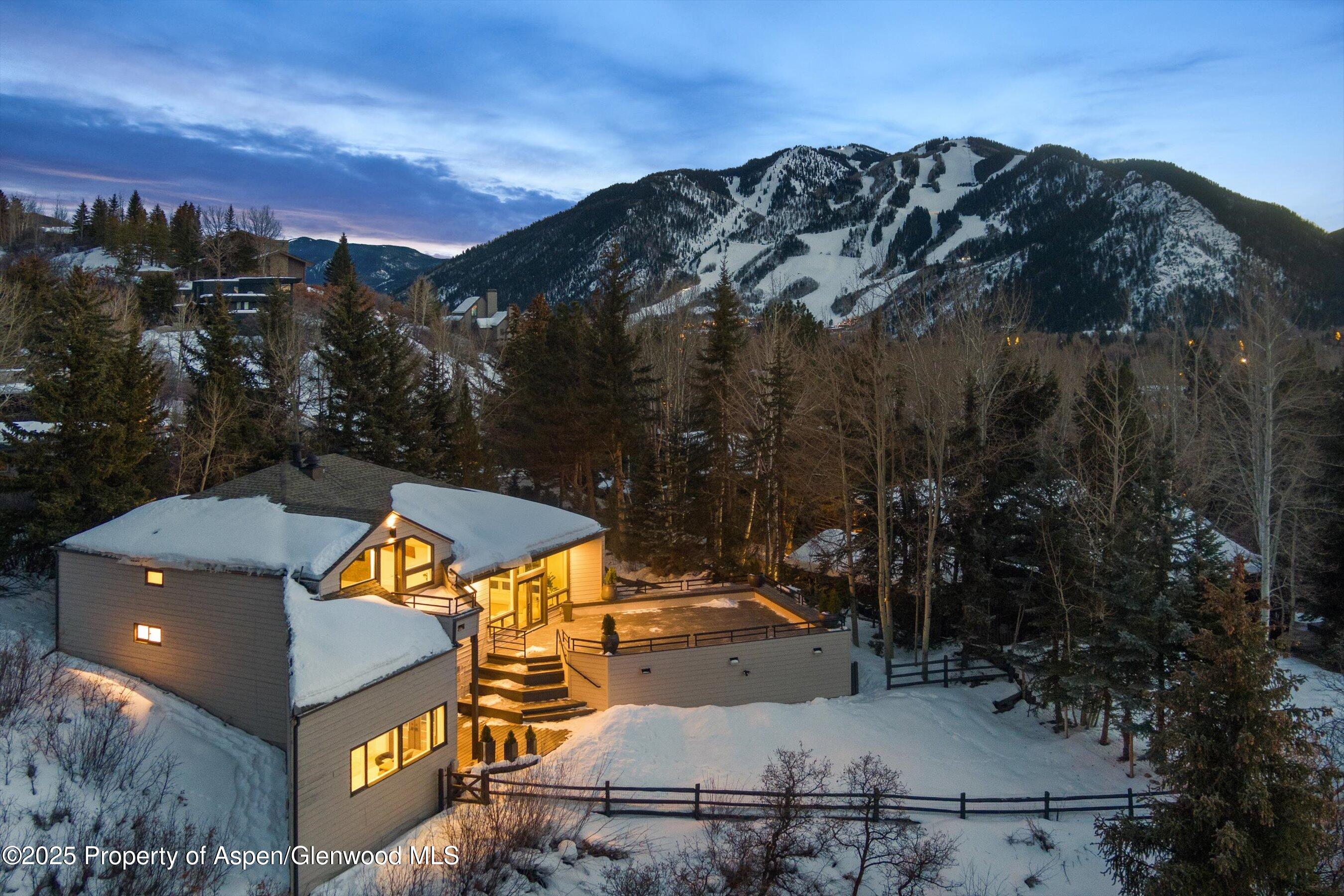75 Bennett Court Aspen, CO 81611 - Photo 65 of 65 an aerial view of a house with a yard and mountain view in back