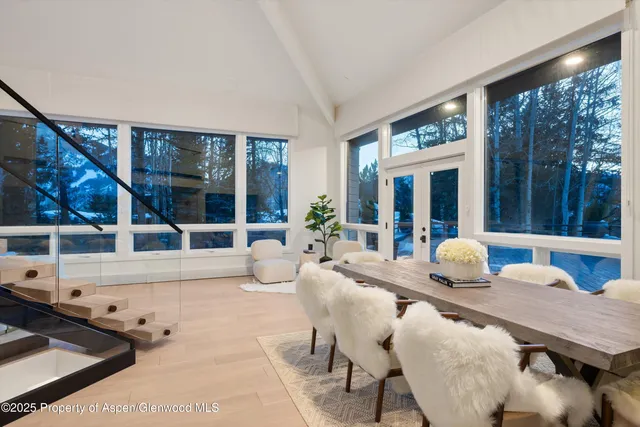 a kitchen with stainless steel appliances granite countertop a refrigerator and a stove