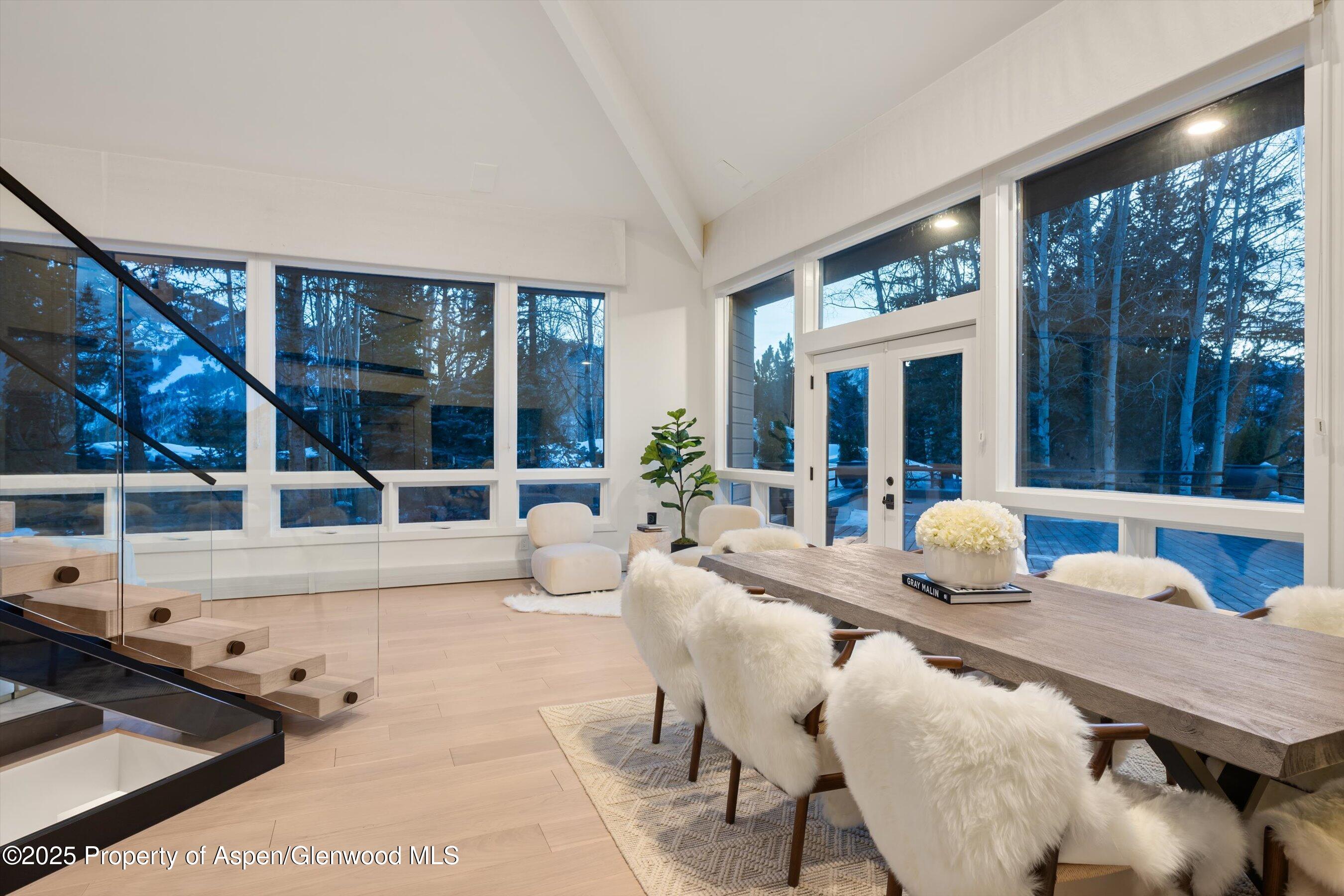 75 Bennett Court Aspen, CO 81611 - Photo 7 of 65 a living room with furniture and large windows