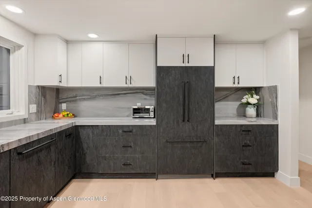 a kitchen with stainless steel appliances granite countertop a stove and a sink