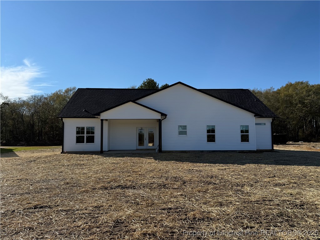 7166 Chicken Foot Road St. Pauls, NC 28384 - Photo 13 of 13 a house with trees in the background