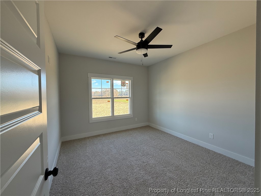 7166 Chicken Foot Road St. Pauls, NC 28384 - Photo 5 of 13 a view of room with window and ceiling fan