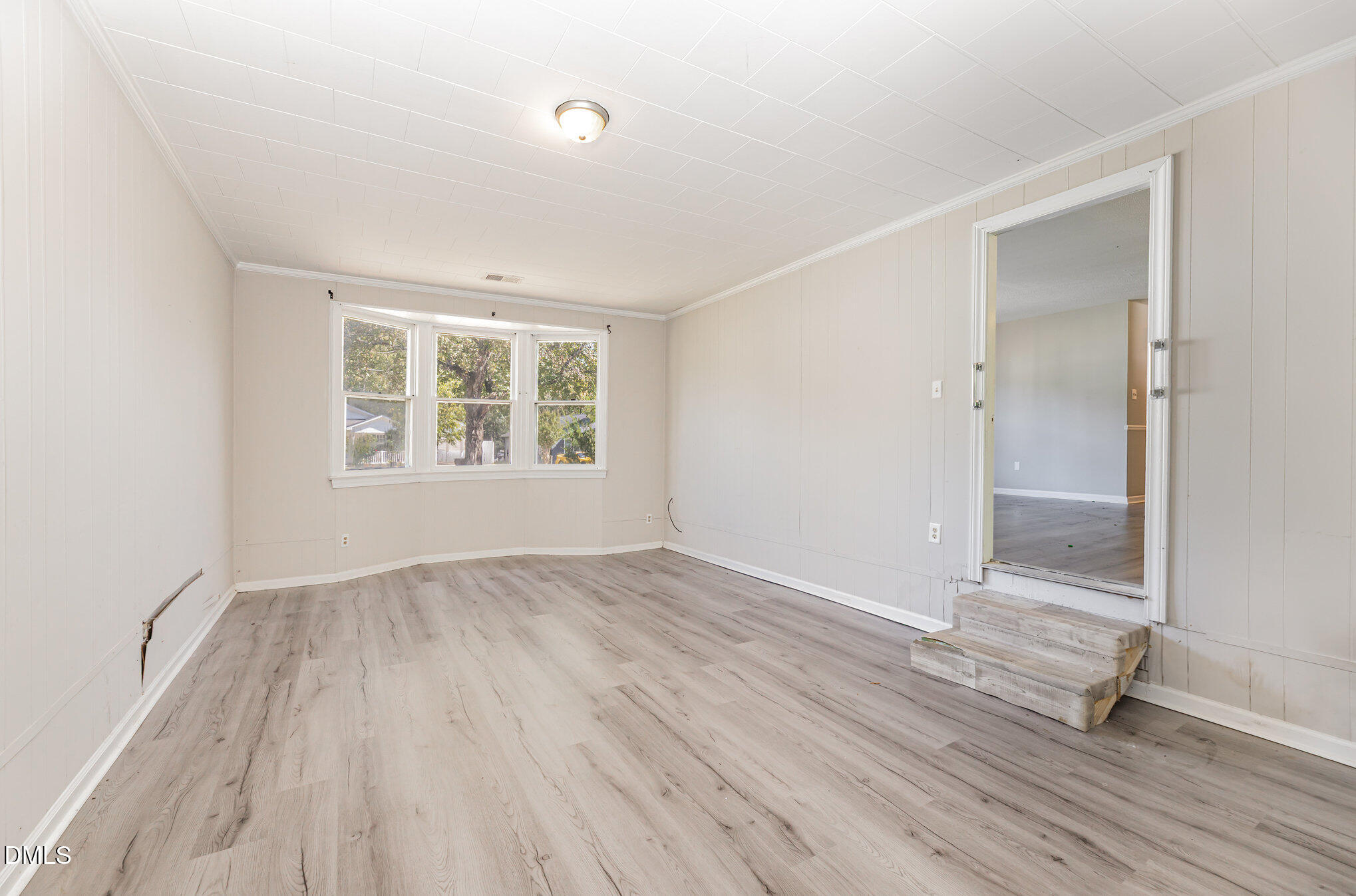 517 Carter Road Graham, NC 27253 - Photo 12 of 27 an empty room with wooden floor and windows