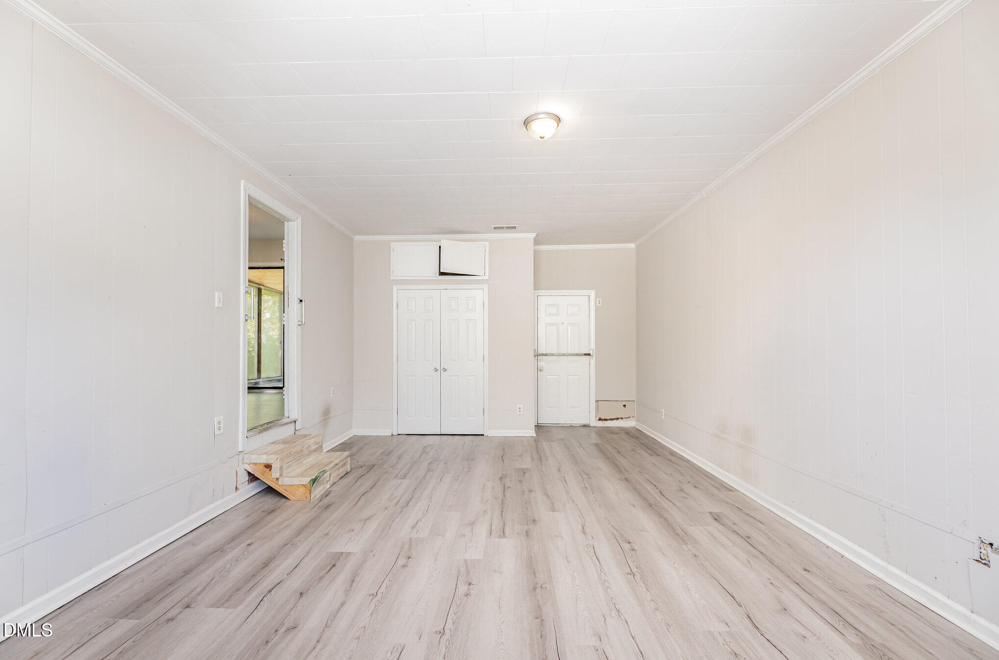 517 Carter Road Graham, NC 27253 - Photo 13 of 27 an empty room with wooden floor and windows