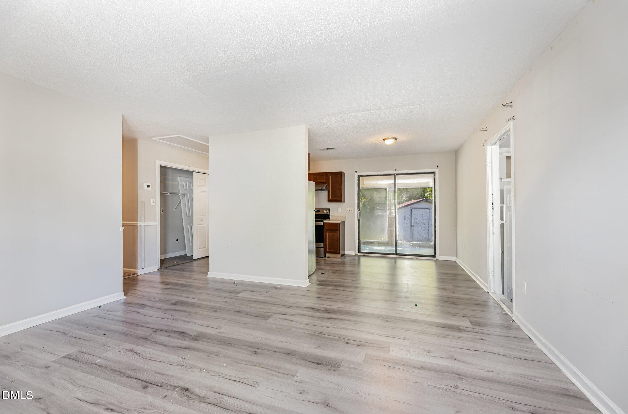 517 Carter Road Graham, NC 27253 - Photo 5 of 27 a view of an empty room with wooden floor and a window
