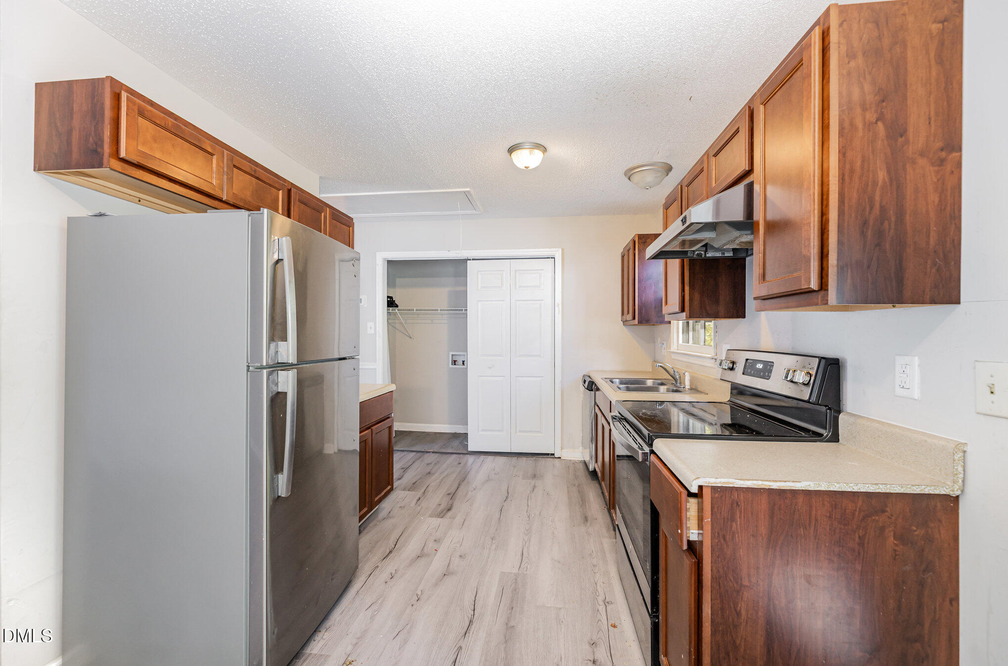517 Carter Road Graham, NC 27253 - Photo 8 of 27 a kitchen with a refrigerator a stove top oven a sink and dishwasher