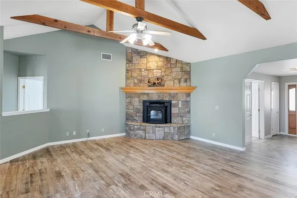 a living room with a fireplace and a table