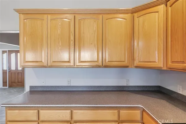 an empty room with a ceiling fan and window