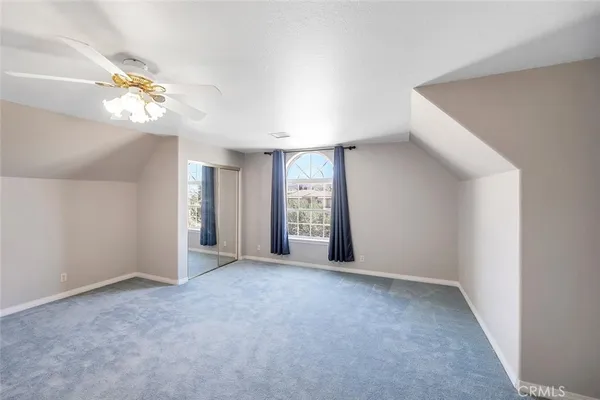 a bathroom with a sink double vanity granite tub and a mirror