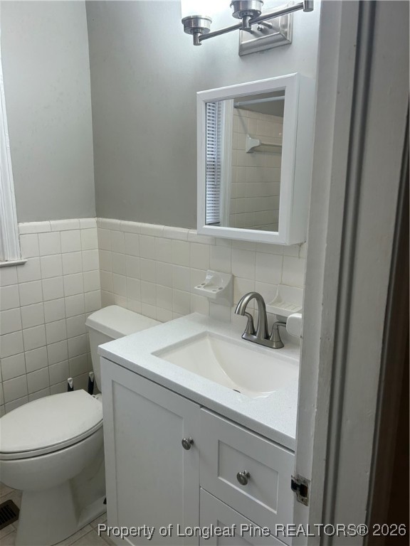 1700 Cedar Creek Road Fayetteville, NC 28312 - Photo 11 of 31 a bathroom with a sink vanity and toilet