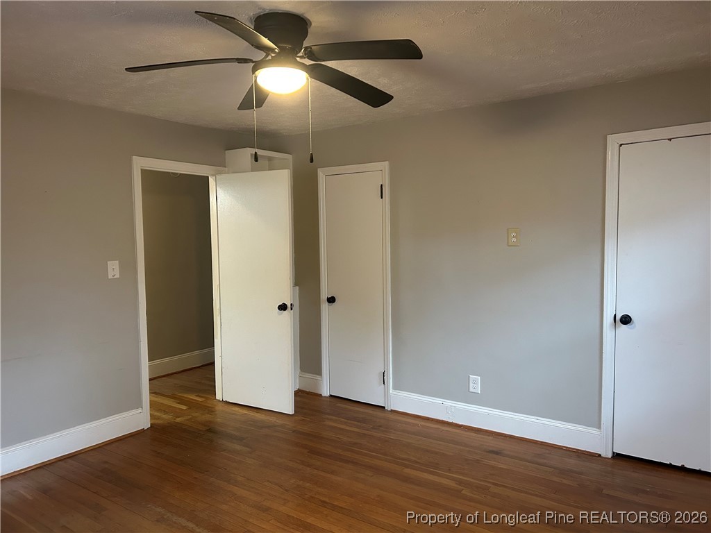 1700 Cedar Creek Road Fayetteville, NC 28312 - Photo 12 of 31 a view of an empty room and wooden floor