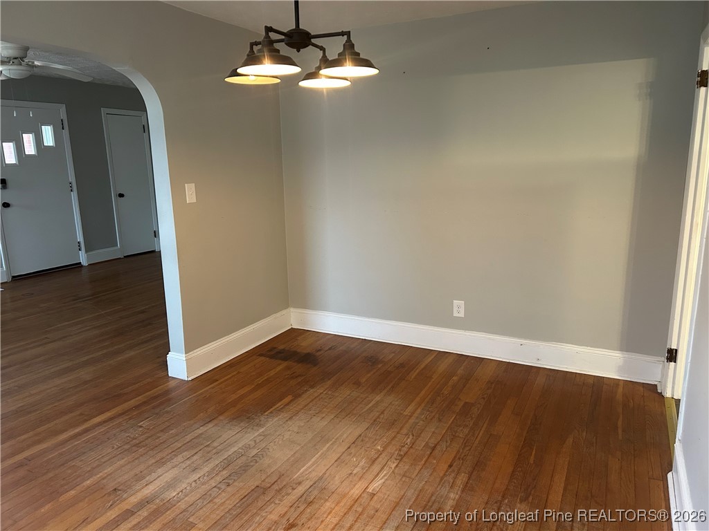 1700 Cedar Creek Road Fayetteville, NC 28312 - Photo 18 of 31 a view of an empty room with wooden floor