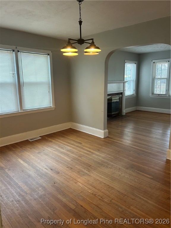 1700 Cedar Creek Road Fayetteville, NC 28312 - Photo 19 of 31 an empty room with wooden floor cabinet and windows