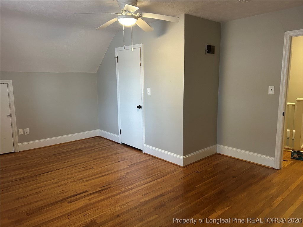 1700 Cedar Creek Road Fayetteville, NC 28312 - Photo 29 of 31 an empty room with wooden floor and door