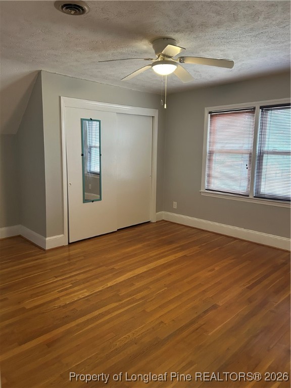 1700 Cedar Creek Road Fayetteville, NC 28312 - Photo 30 of 31 an empty room with wooden floor chandelier fan and windows