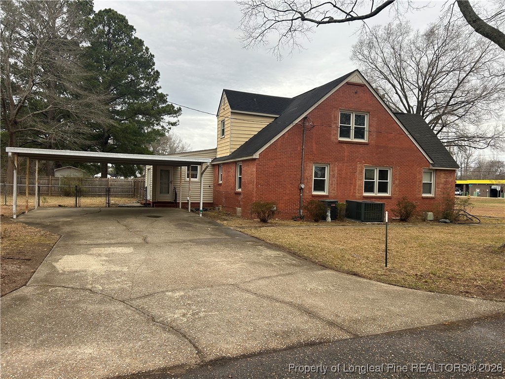 1700 Cedar Creek Road Fayetteville, NC 28312 - Photo 3 of 31 a view of a house with a patio