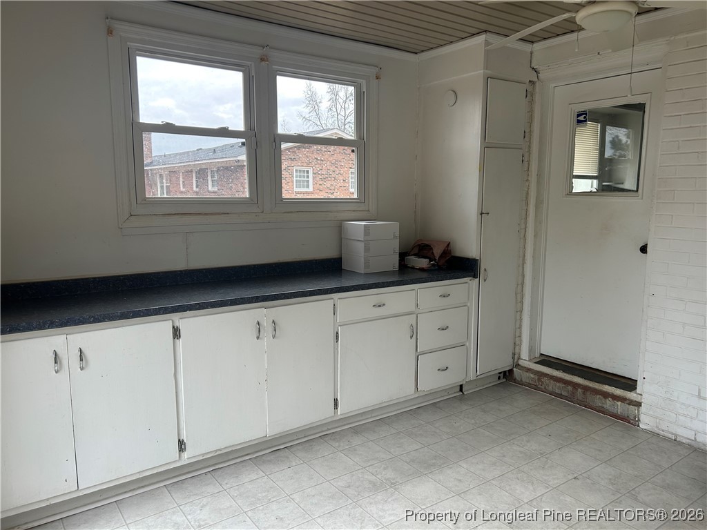 1700 Cedar Creek Road Fayetteville, NC 28312 - Photo 8 of 31 a room with cabinets and window