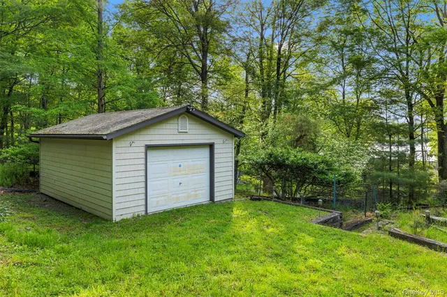 a view of a backyard with a large tree