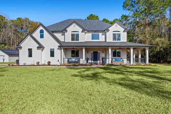 a view of a house with swimming pool