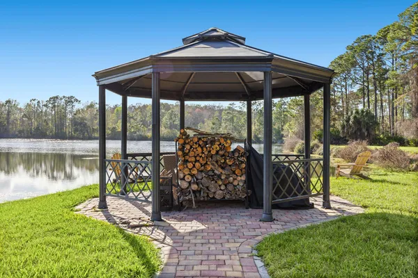 a living room with furniture and a ceiling fan