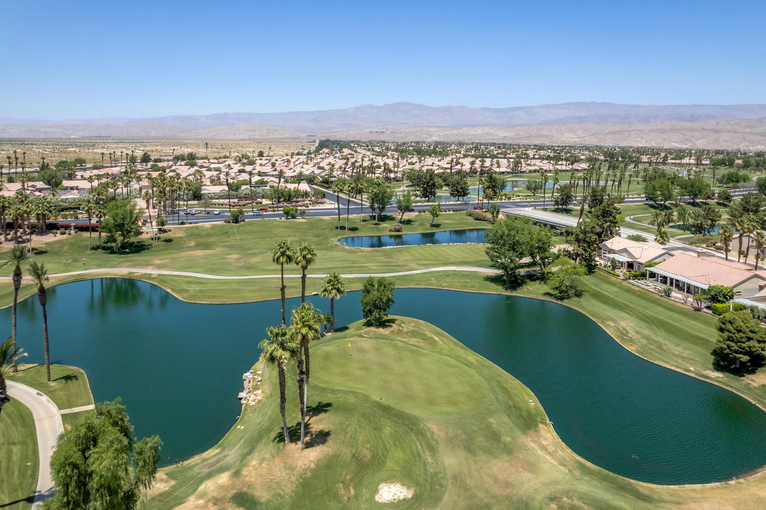 39623 Manorgate Road Palm Desert, CA 92211 - Photo 11 of 42 view of a lake with a city