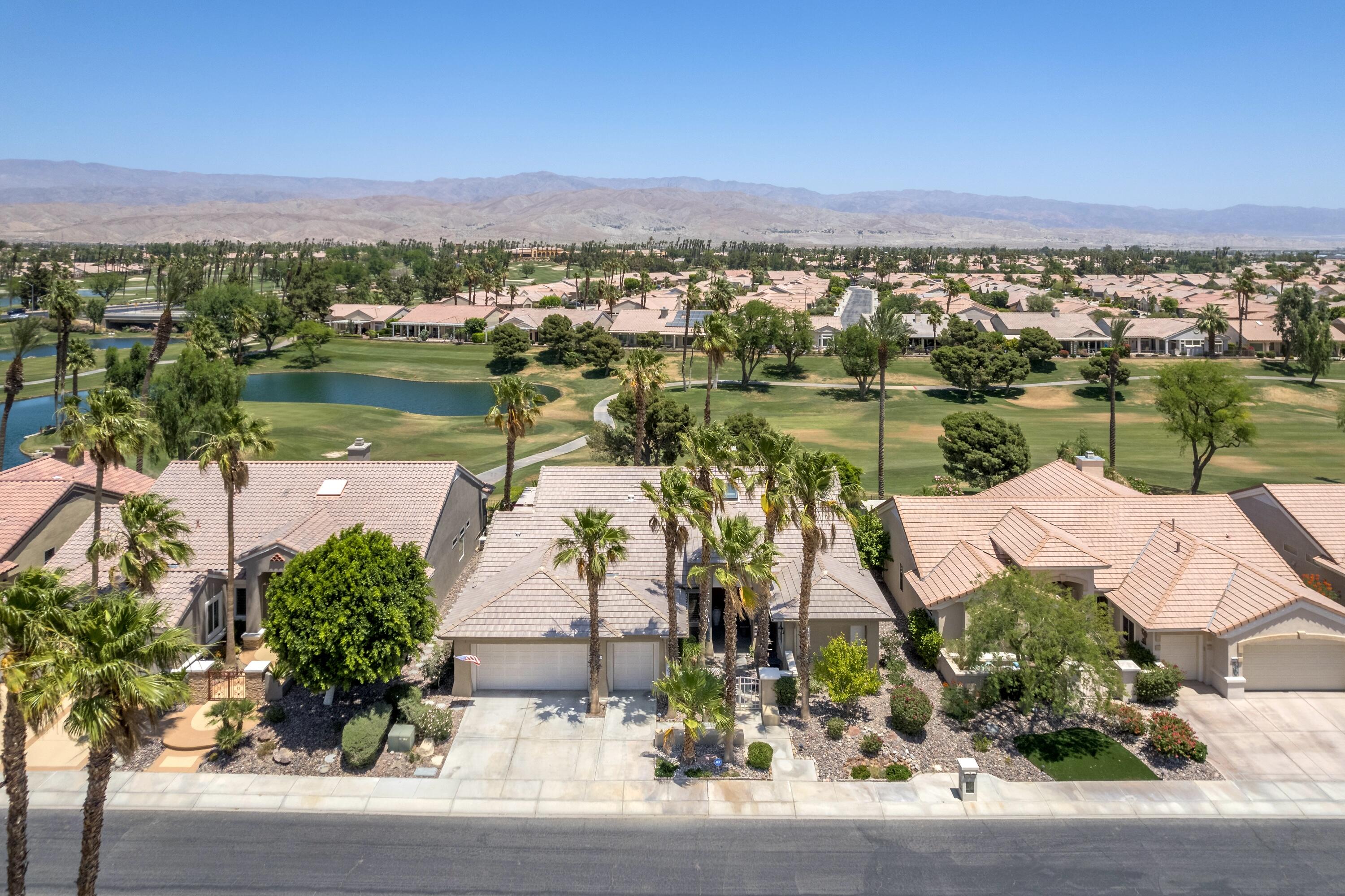 39623 Manorgate Road Palm Desert, CA 92211 - Photo 12 of 42 an aerial view of lake residential house with outdoor space and seating