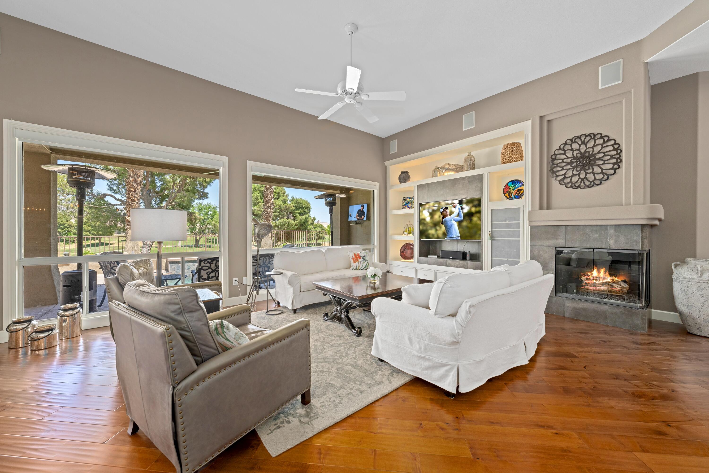39623 Manorgate Road Palm Desert, CA 92211 - Photo 16 of 42 a living room with furniture and a fireplace