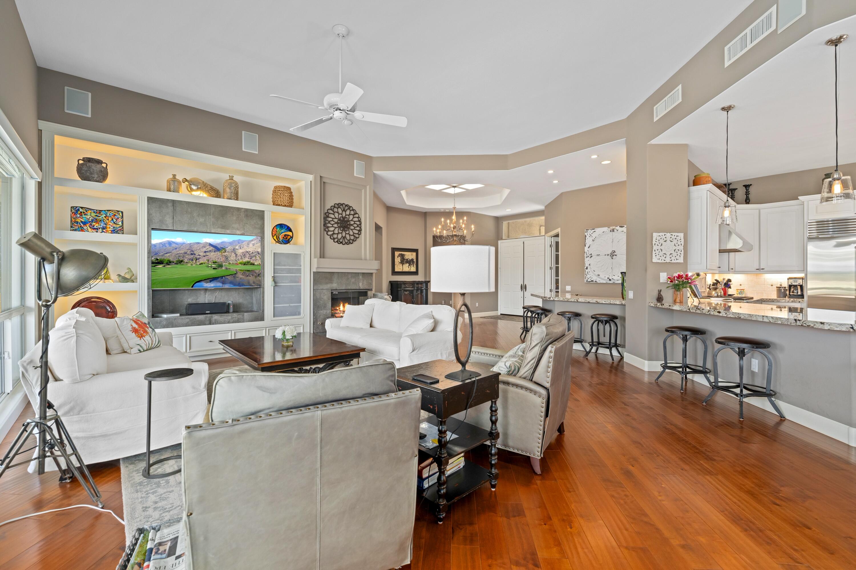 39623 Manorgate Road Palm Desert, CA 92211 - Photo 17 of 42 a living room with furniture and wooden floor