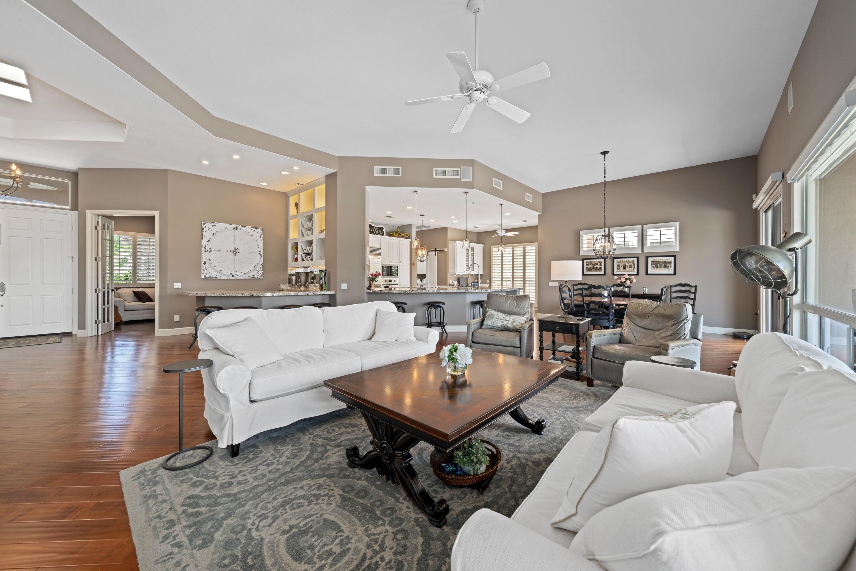 39623 Manorgate Road Palm Desert, CA 92211 - Photo 19 of 42 a living room with furniture and a wooden floor
