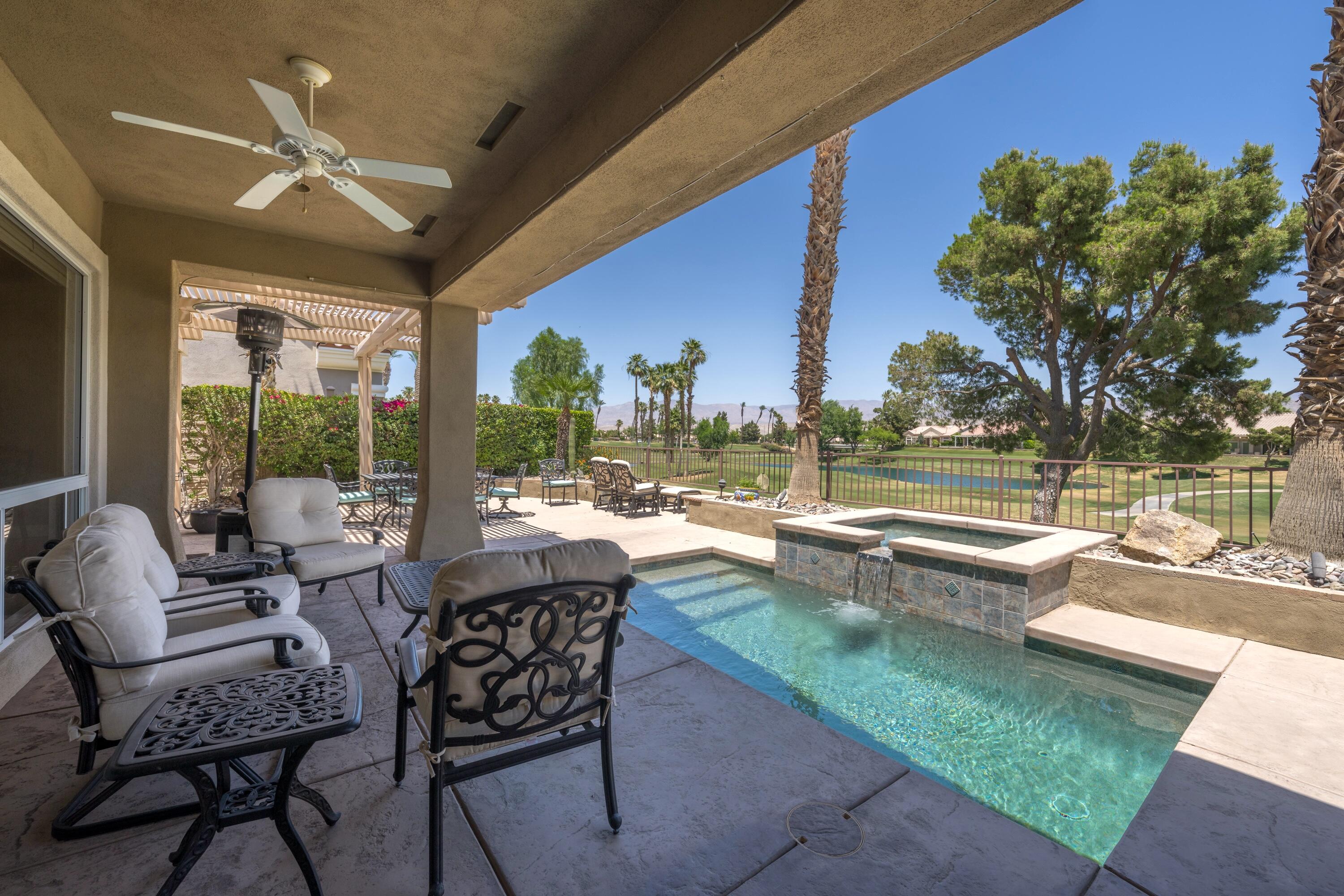 39623 Manorgate Road Palm Desert, CA 92211 - Photo 2 of 42 a view of swimming pool with outdoor seating and a yard