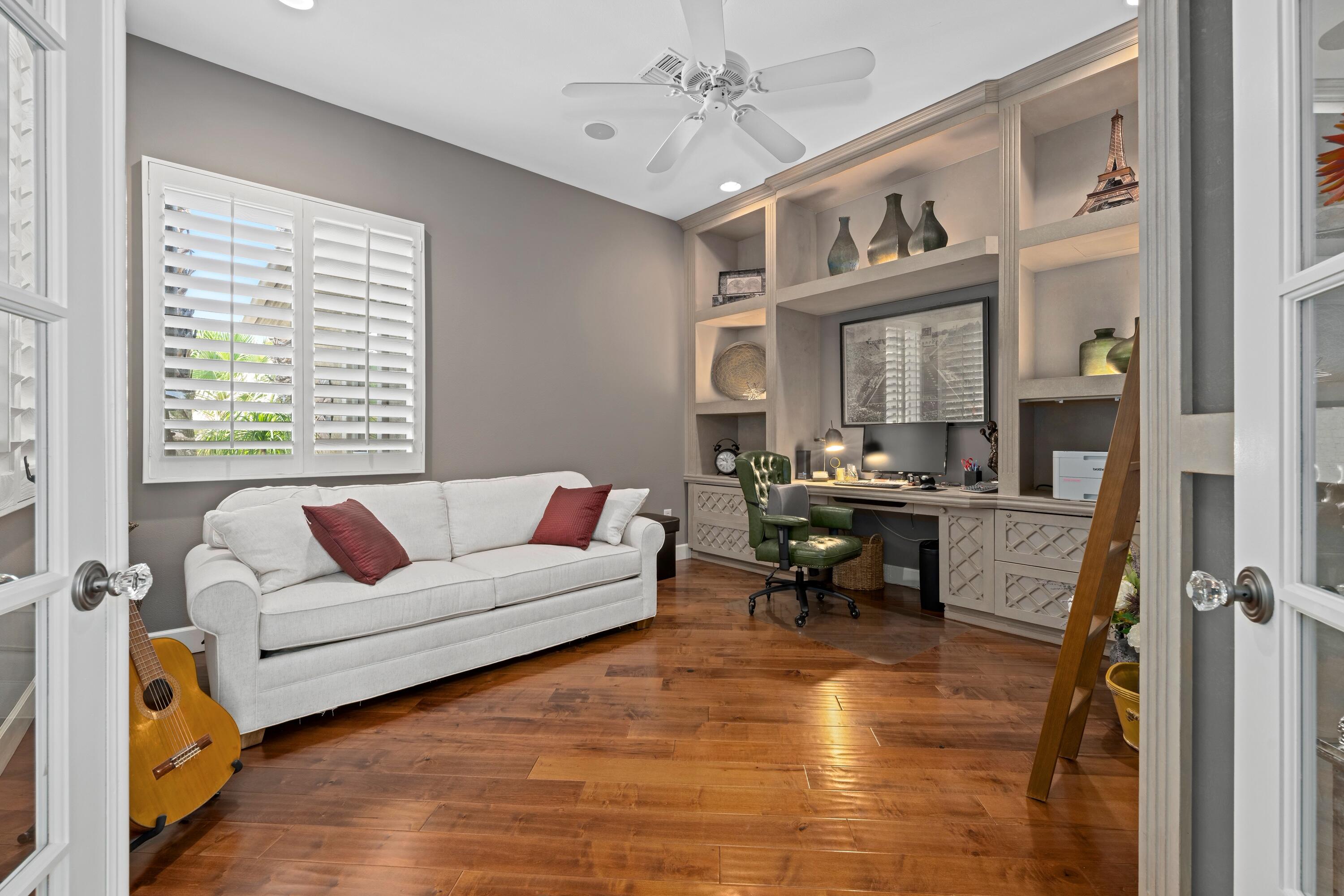 39623 Manorgate Road Palm Desert, CA 92211 - Photo 26 of 42 a living room with furniture and a dining table with bookshelf