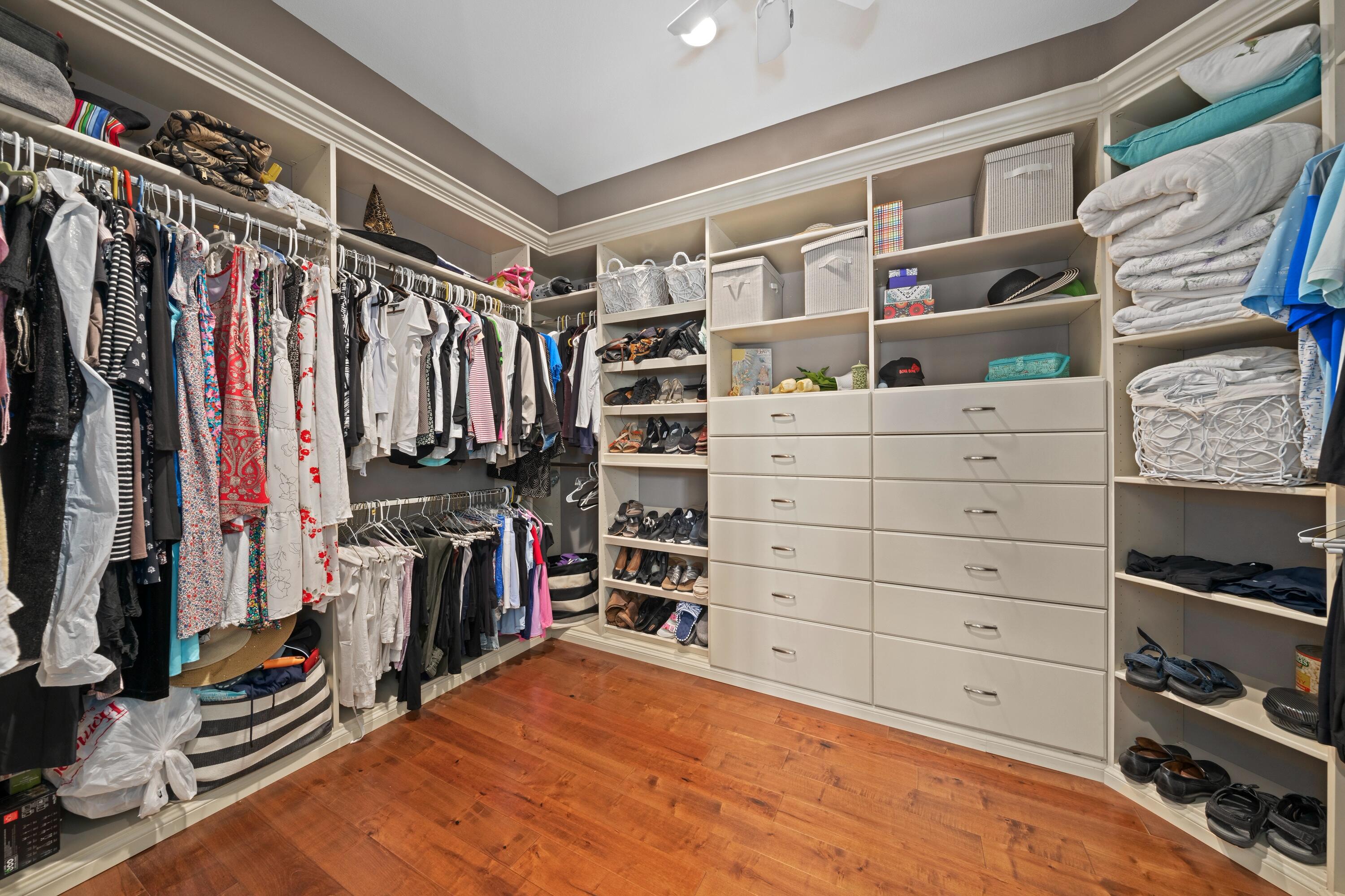 39623 Manorgate Road Palm Desert, CA 92211 - Photo 29 of 42 a view of walk in closet with clothes and shoes