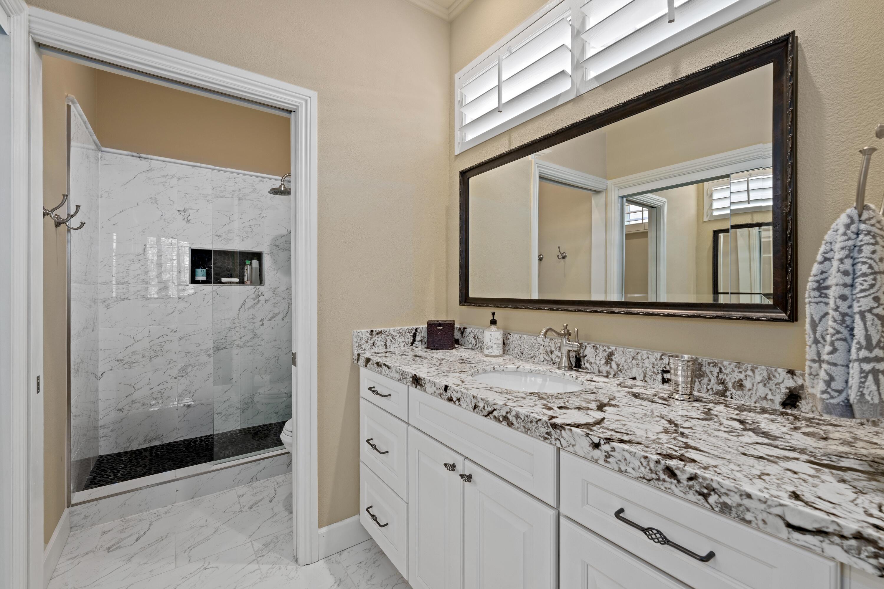39623 Manorgate Road Palm Desert, CA 92211 - Photo 33 of 42 a bathroom with a sink and a mirror