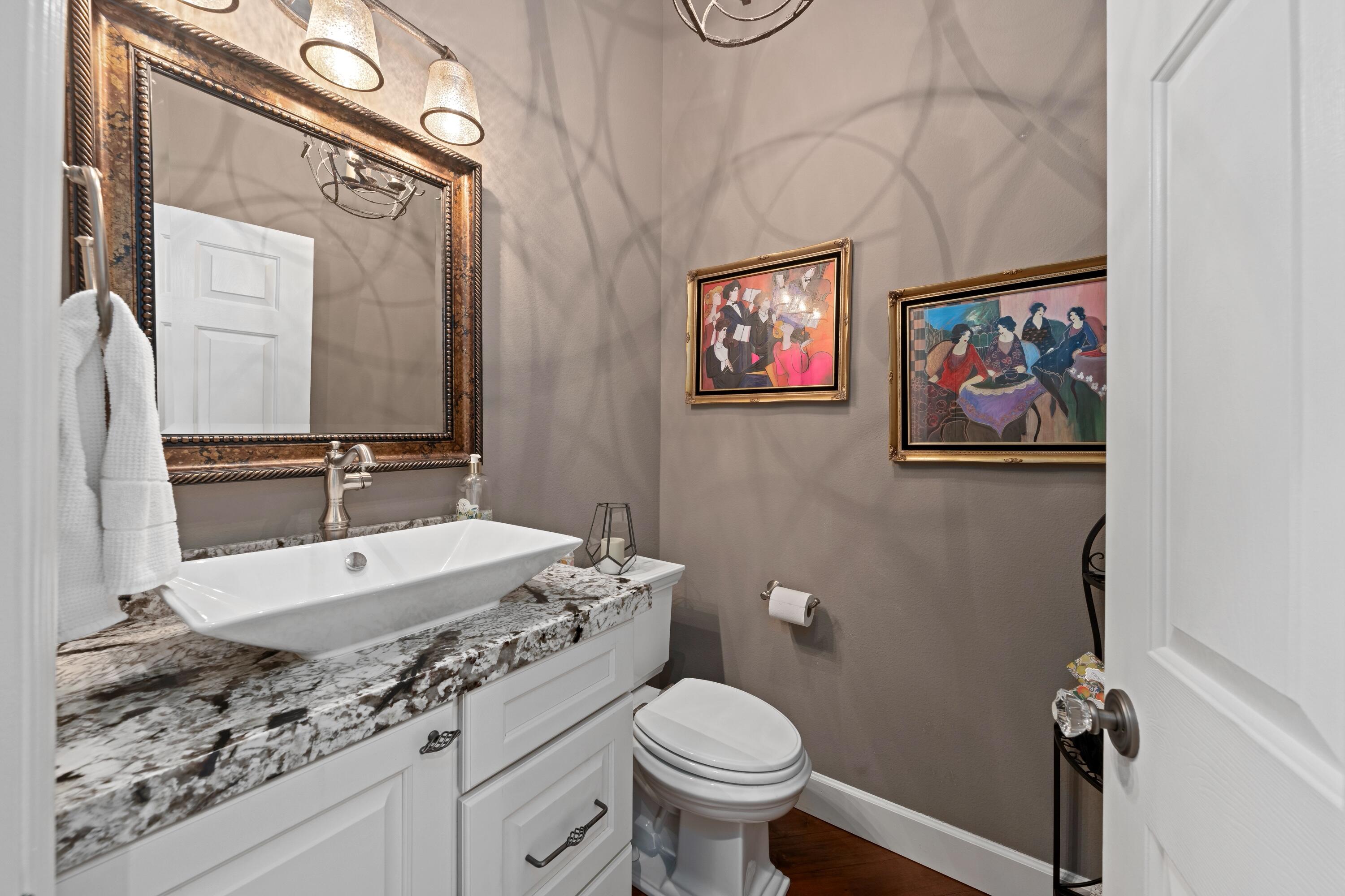 39623 Manorgate Road Palm Desert, CA 92211 - Photo 34 of 42 a bathroom with a granite countertop sink mirror vanity and toilet
