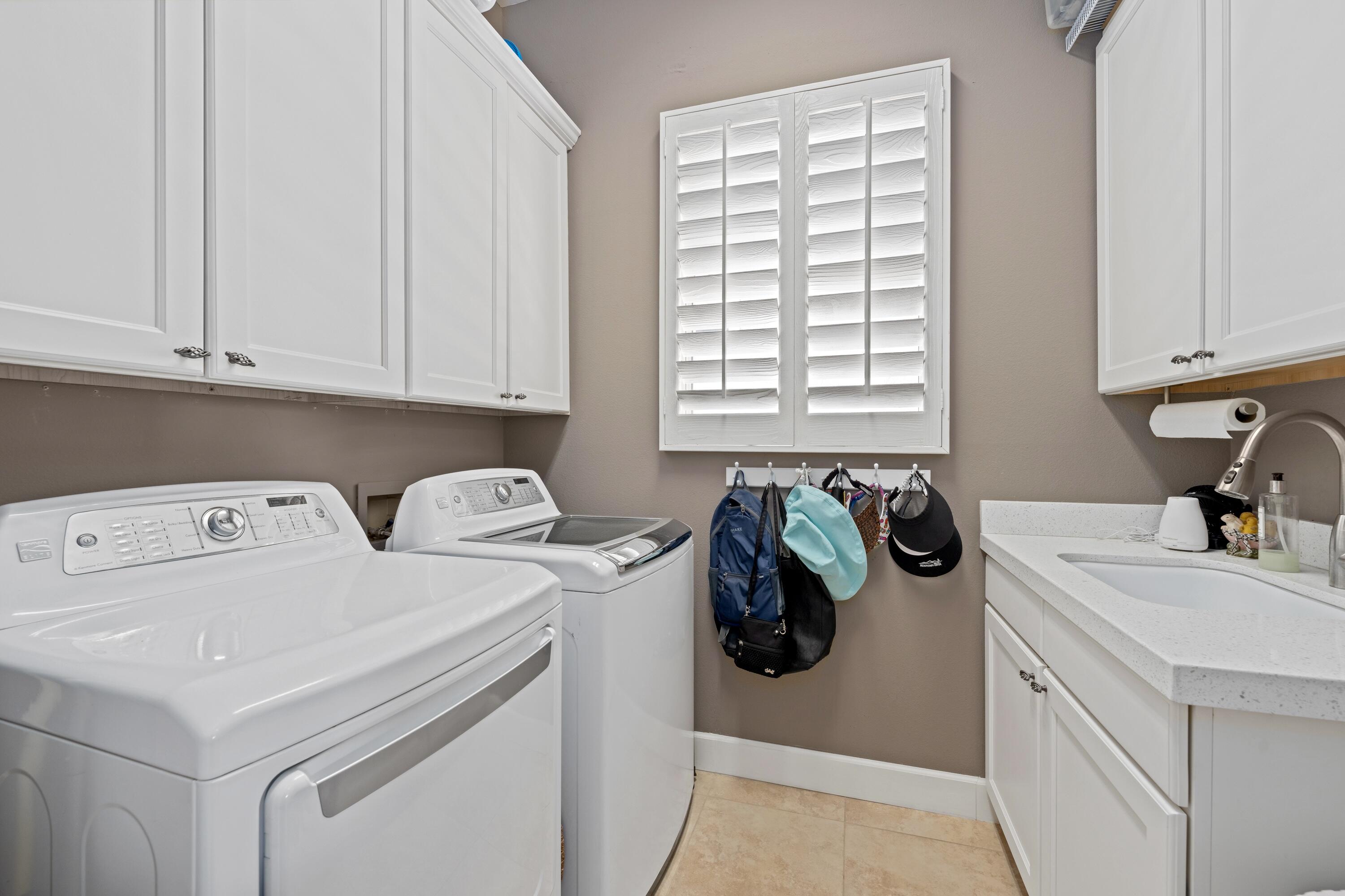 39623 Manorgate Road Palm Desert, CA 92211 - Photo 35 of 42 a utility room with dryer and washer