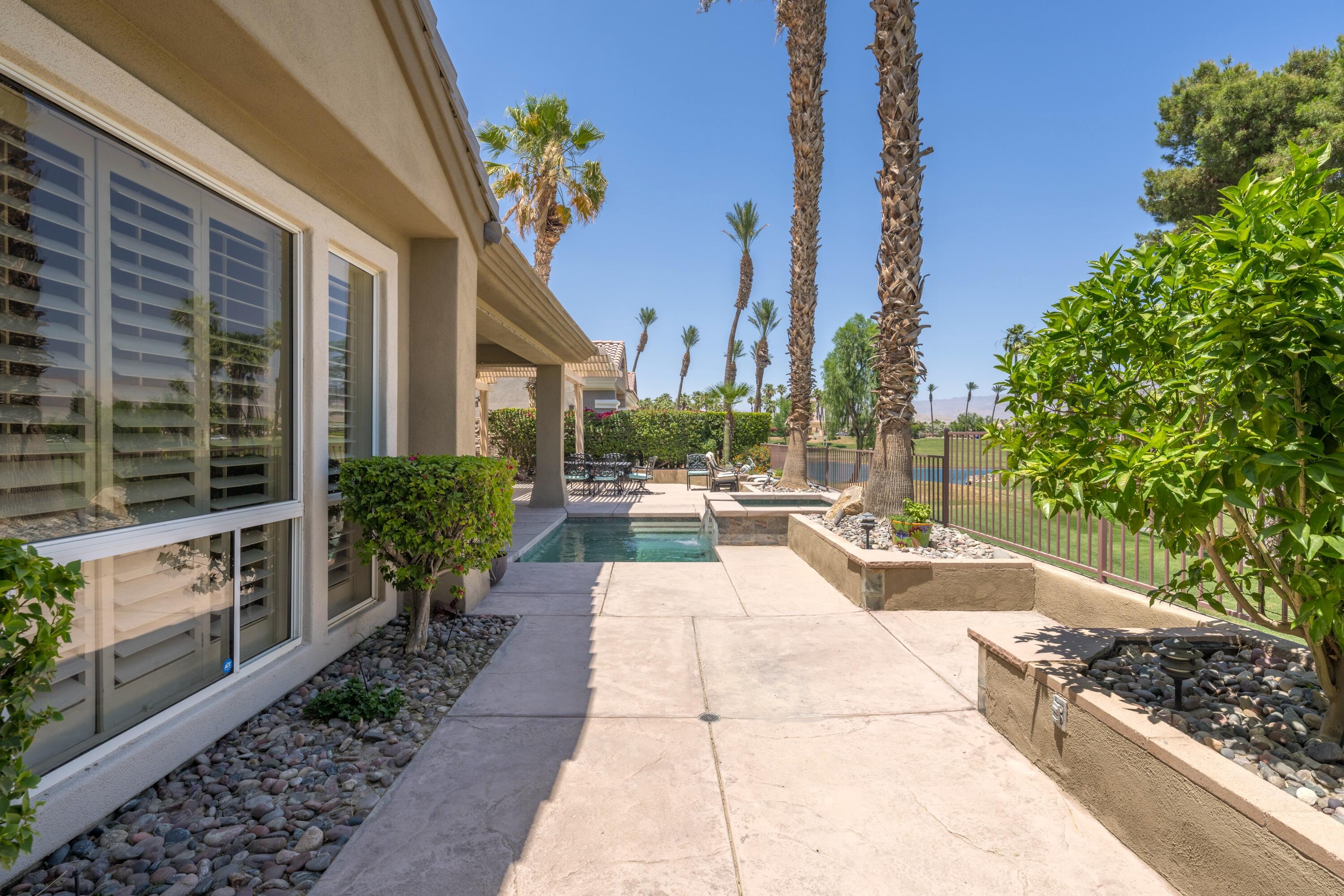 39623 Manorgate Road Palm Desert, CA 92211 - Photo 42 of 42 a view of a patio with couches and potted plants