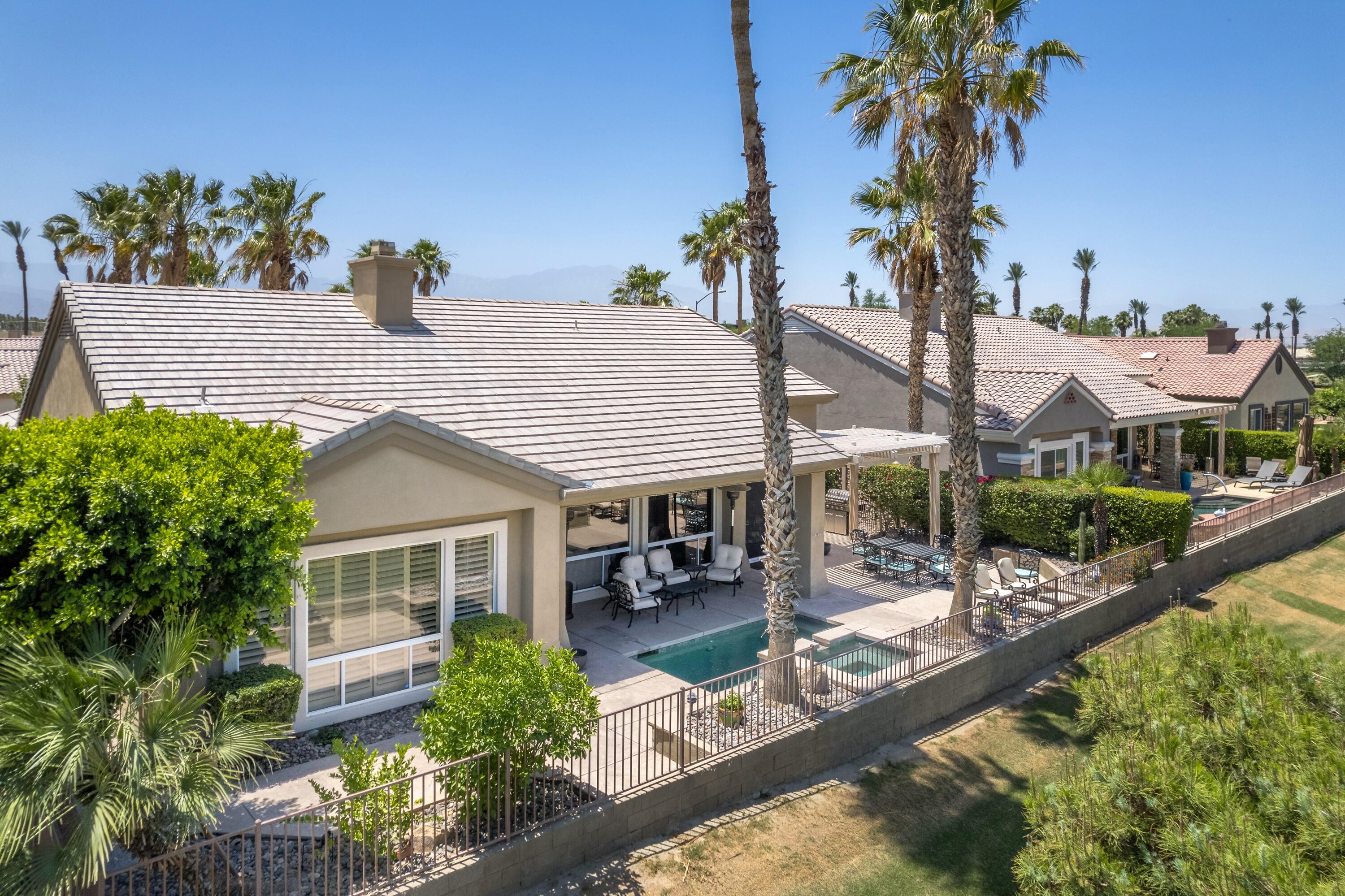 39623 Manorgate Road Palm Desert, CA 92211 - Photo 5 of 42 a view of a house with backyard and sitting area