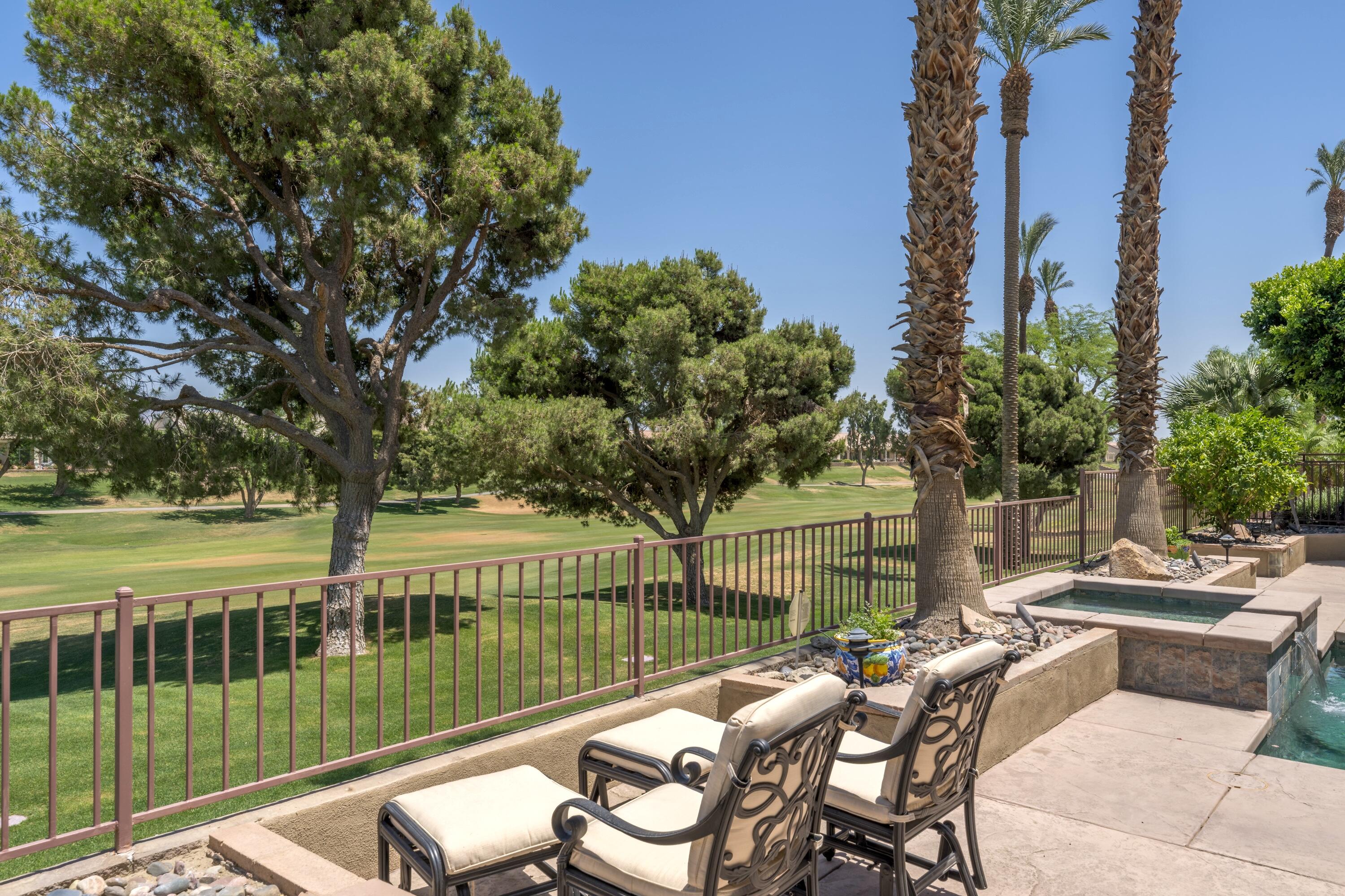 39623 Manorgate Road Palm Desert, CA 92211 - Photo 10 of 42 a view of a balcony with two chairs and a table
