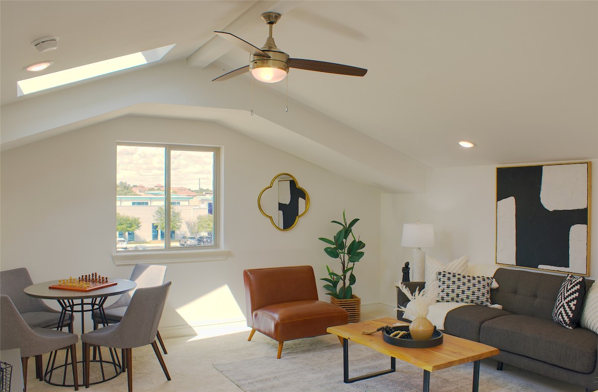 304 Tesla Circle Austin, TX 78681 - Photo 16 of 38 Living area with carpet floors, ceiling fan, recessed lighting, and a skylight