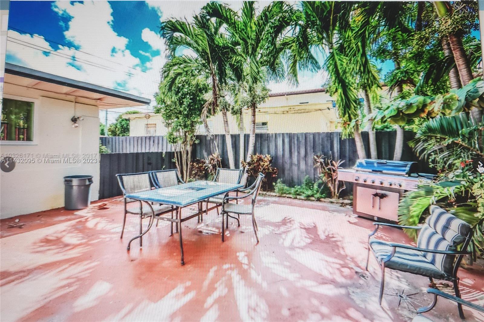 3101 Southwest 18th Street Miami, FL 33145 - Photo 5 of 11 a table and chairs in front of a house