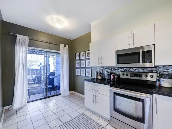a kitchen with a stove and a microwave
