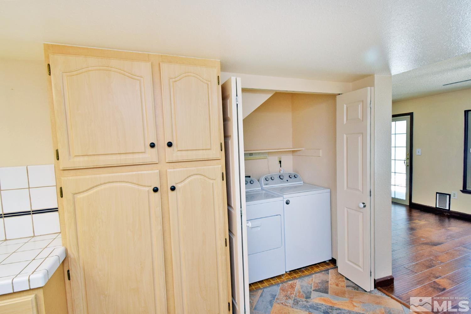 1113 Frontier Court Reno, NV 89503 - Photo 17 of 40 a view of walk in closet with wooden floor