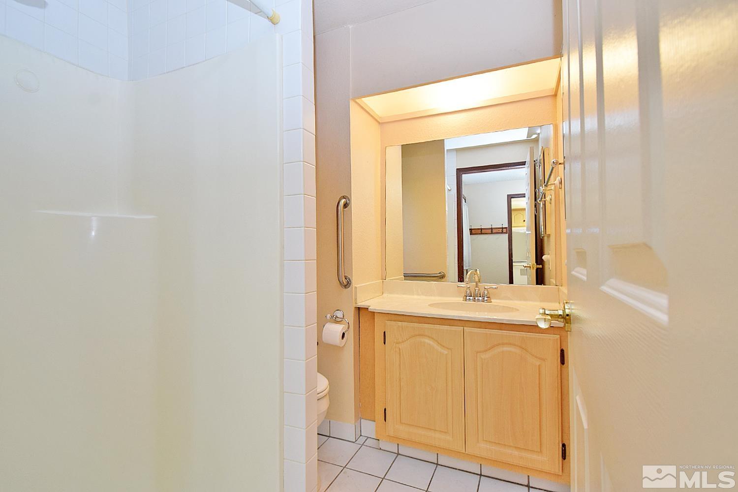 1113 Frontier Court Reno, NV 89503 - Photo 22 of 40 a view of a bathroom with mirror and sink
