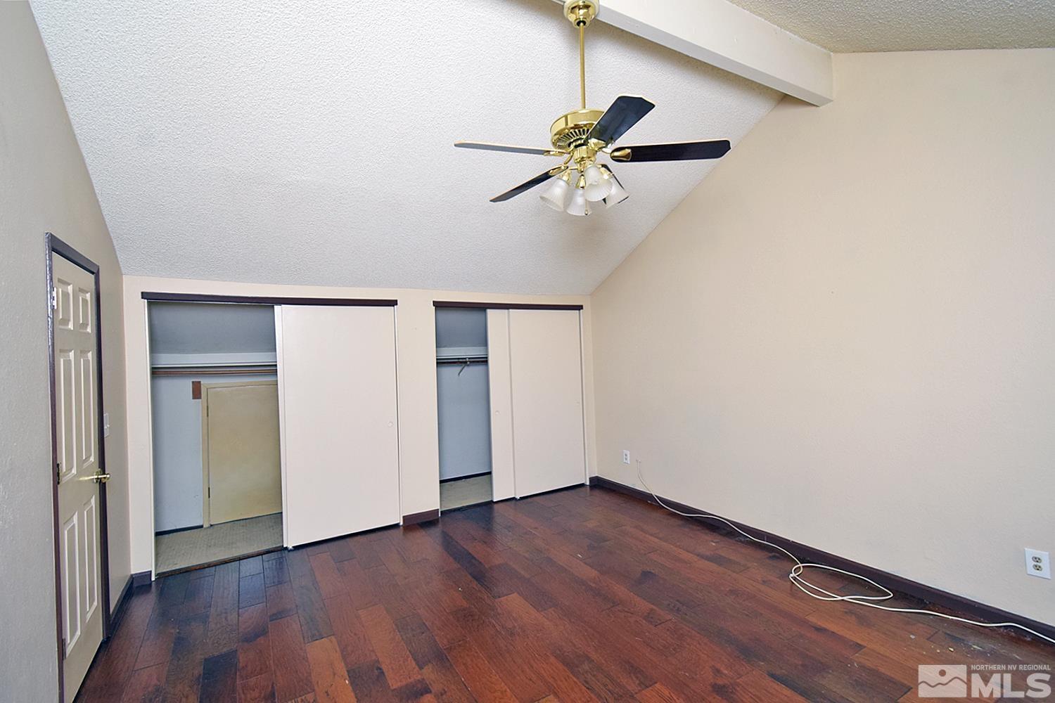 1113 Frontier Court Reno, NV 89503 - Photo 26 of 40 a view of an empty room with wooden floor