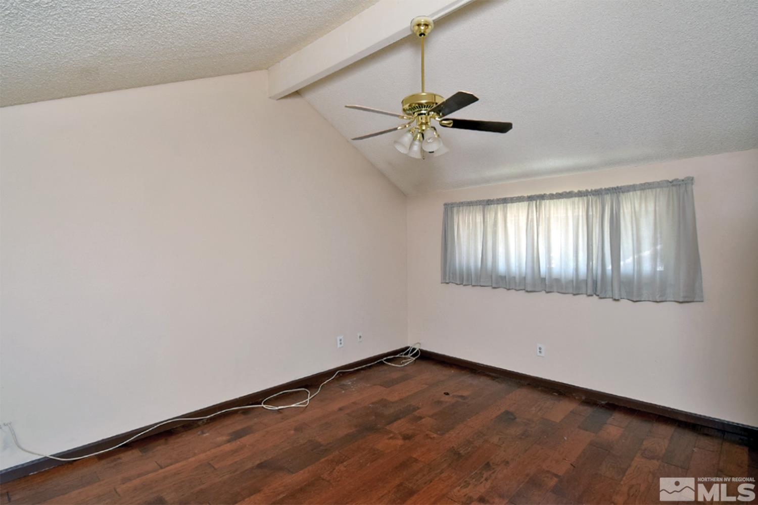 1113 Frontier Court Reno, NV 89503 - Photo 27 of 40 a view of an empty room and window with a ceiling fan
